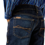 Close-up of back pocket with a brand label