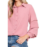 Close up of a solid mauve shirt with tiered ruffle long sleeves