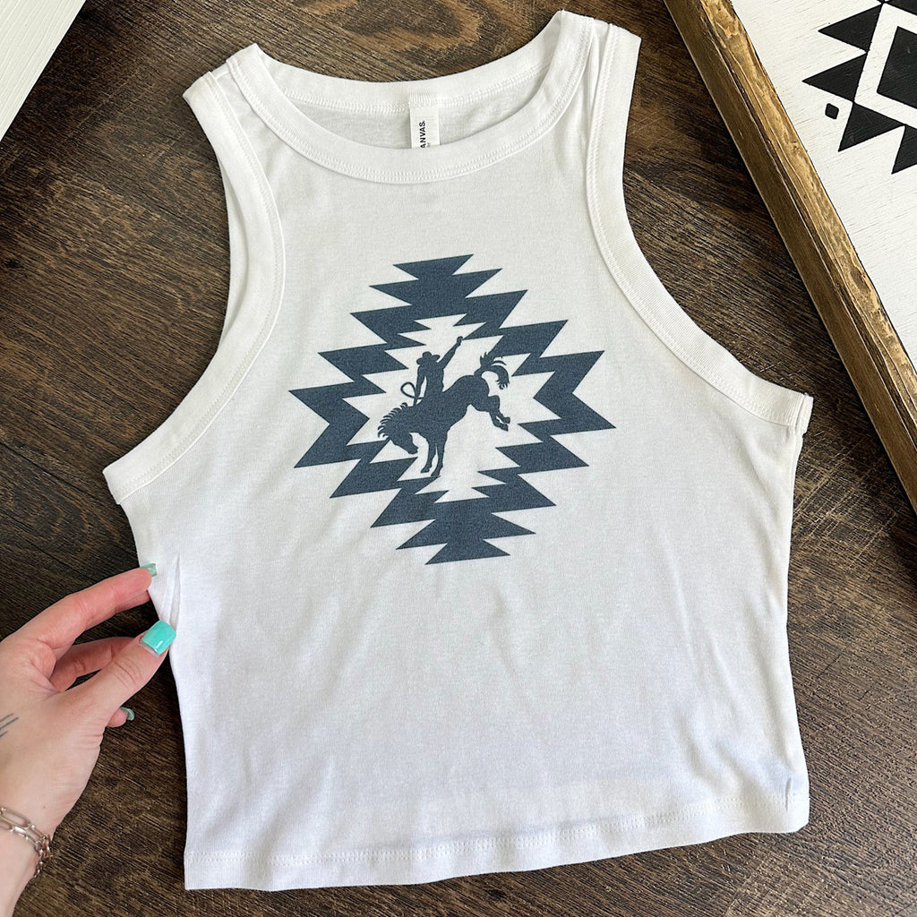 White Cropped tank top with navy blue Aztec design and bronc rider in the middle. 