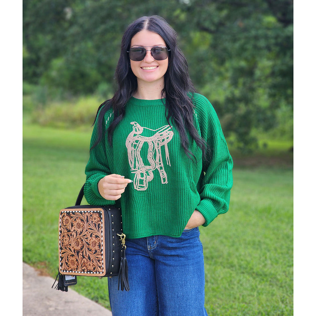 green knit sweater with saddle on front 