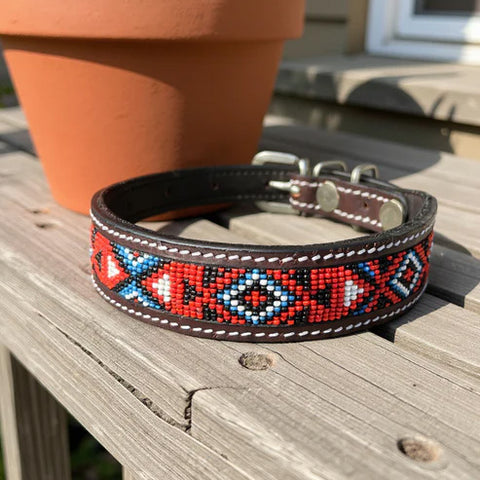 Leather dog collar with geometric red, blue, black, and white beaded design. 