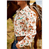 Side view of a cream colored shirt with bucking horse and western motiffs.