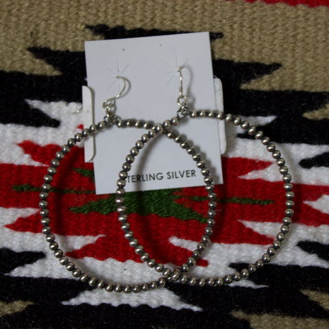 Large hoop earrings with 3mm size Navajo pearls and a hook attachment.