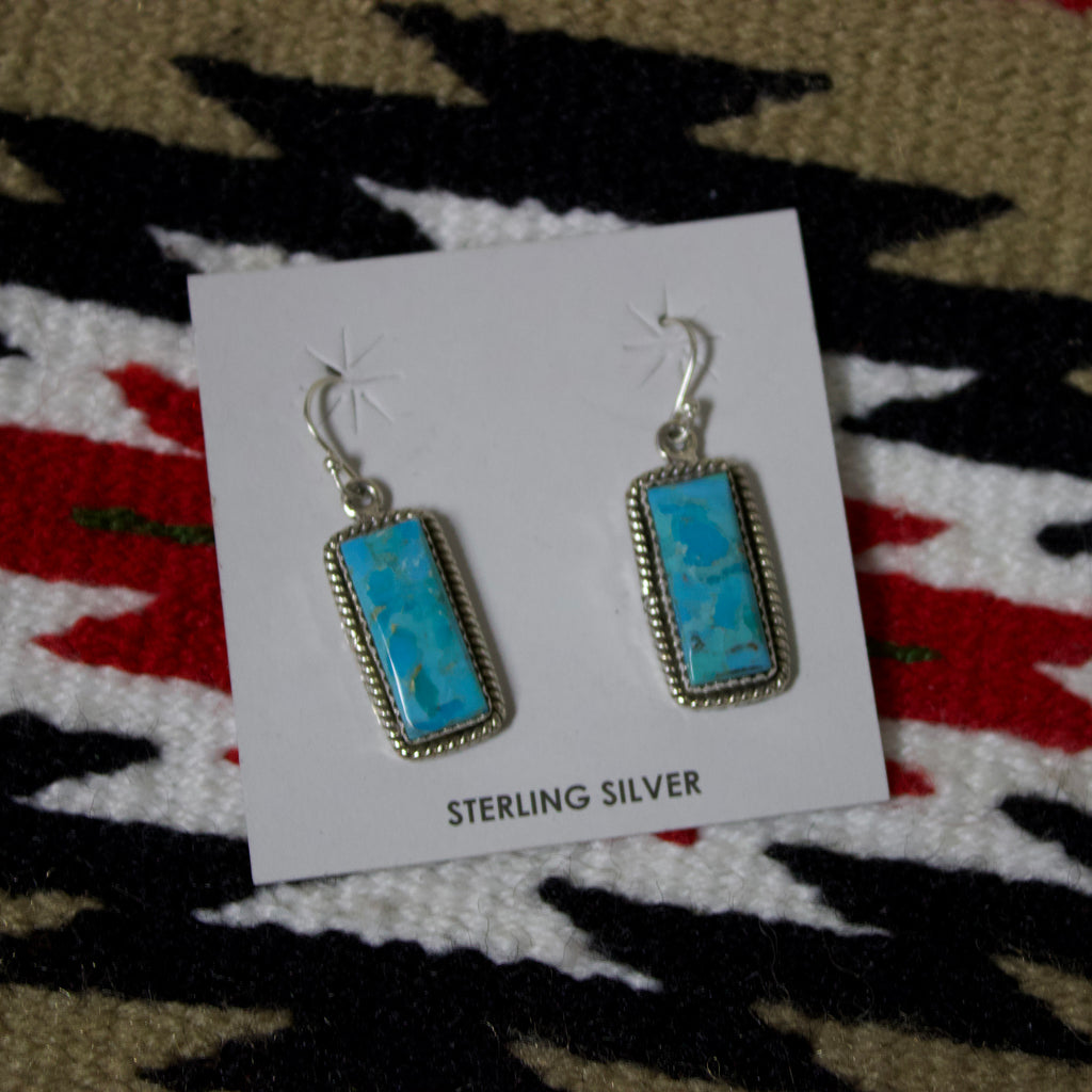 Sterling silver earrings with long rectangle turquoise stones.