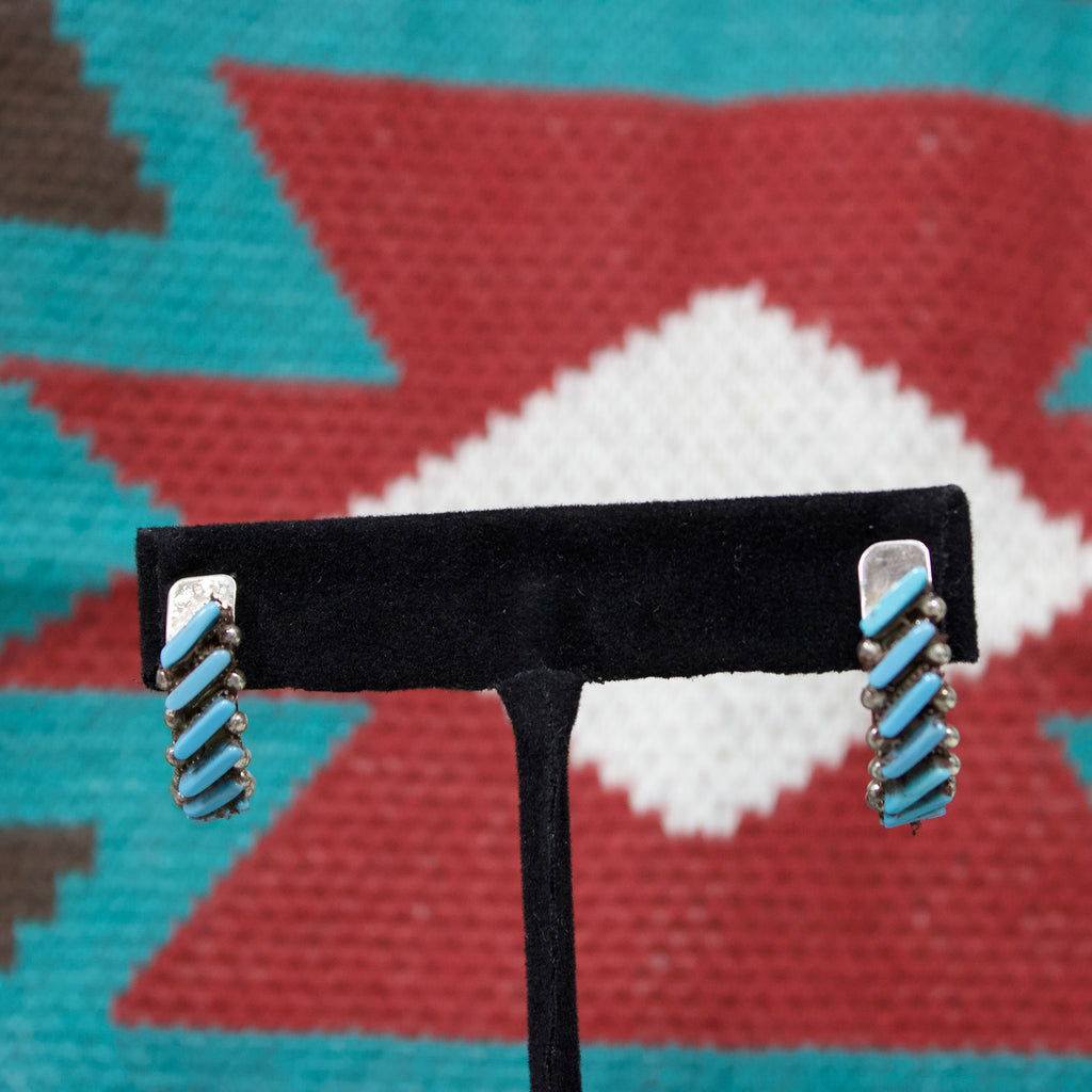 Sterling silver half hoop earrings with slanted turquoise bars and silver dots. 
