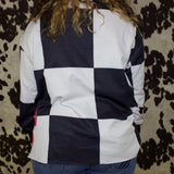 Back of the long sleeve, same as the front of the shirt with large black and white checkered print.