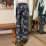 Back side view of the pants, they feature two back pockets and an elastic waist line. 