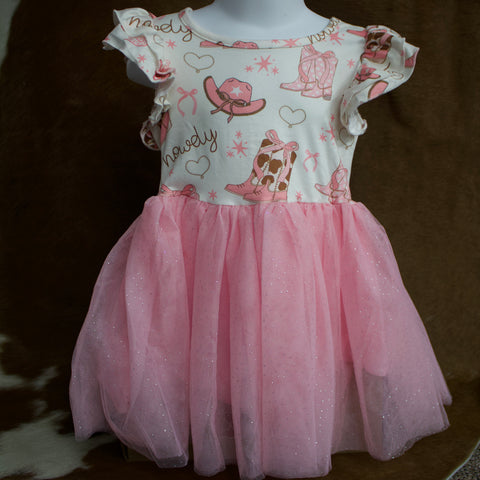 Youth Mannequin wearing a girl's dress that is white with brown and pink boots, hats, bows, and hearts printed on it and ruffled sleeves. the bottom of the dress is a layered sparkly pink tutu.