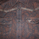 Close up view of the shirt, has both light and dark brown colors with white stitching. 