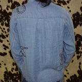 Back side of the shirt, mostly plain aside from few embroidered designs.