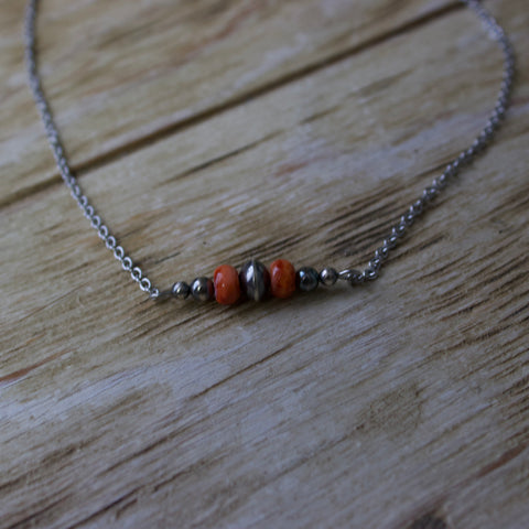 Sterling silver chain necklace with a small Navajo style pearl bar with two spiny stones.