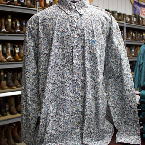 White long sleeve button down shirt with blue floral print.