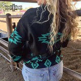 back view of woman wearing black pullover with turquoise Aztec patterns