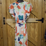 Back side view of the dress, it also features ruffle sleeves. 