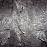Close up view of the shirt, snaps are black and the shirt has double chest snap flap pockets.
