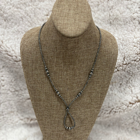 18" inch length Navajo pearl lariat style necklace with graduated size pearls and a loop at the bottom 