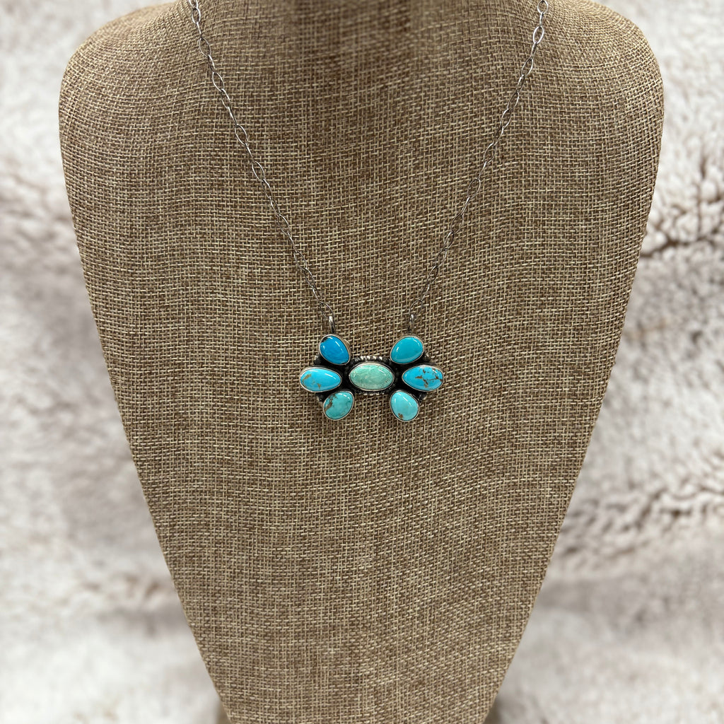 Sterling Silver 7 stone pendant necklace, Multi colored turquoise stones, 1 blue/green stone in the middle and 3 turquoise stones on each side  