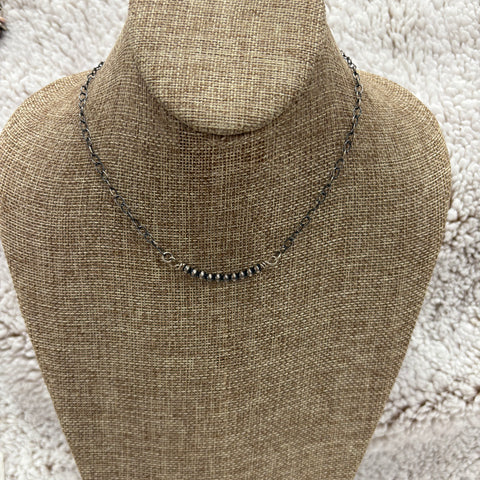 Dainty silver necklace with small Navajo pearls in the middle 