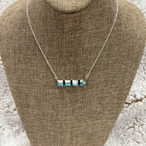 Sterling Silver bar necklace with 4 small square blue and white cotton candy stones 