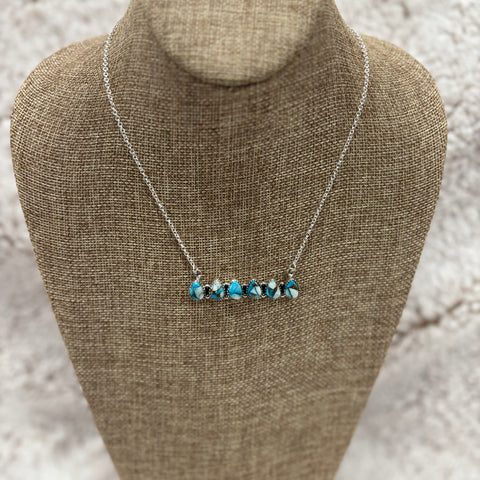 Sterling Silver bar necklace with 6 small white buffalo and turquoise teardrop shaped stones 