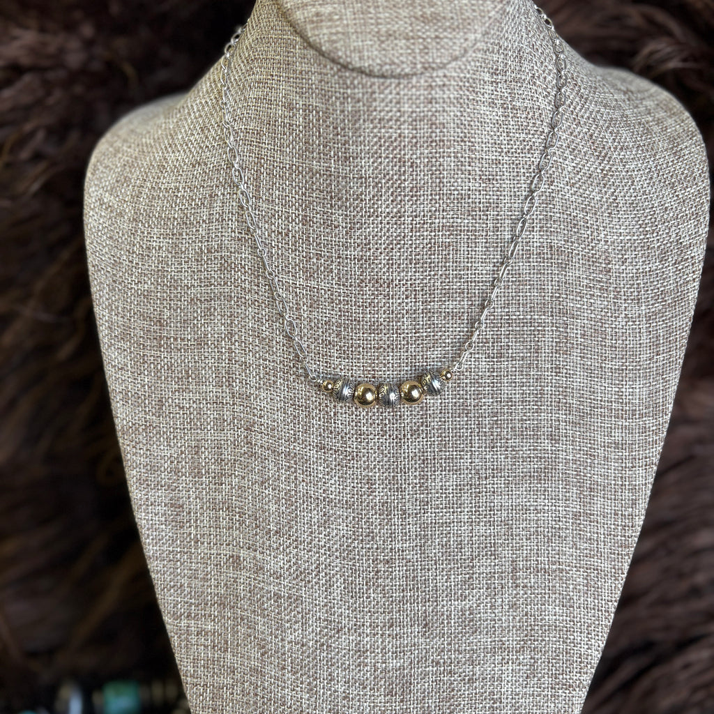 Chain necklace with alternating gold and stamped Navajo pearl necklace 