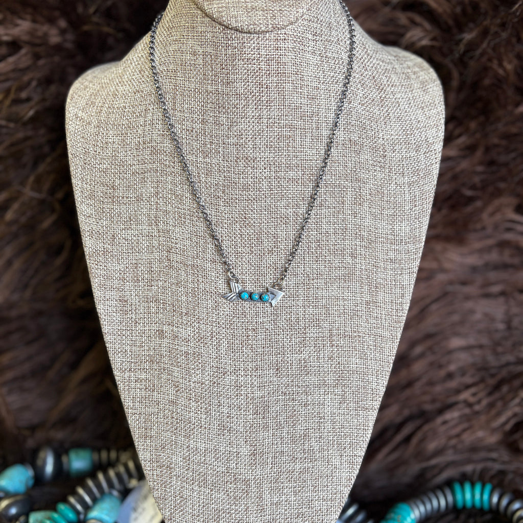 Sterling silver chain with small curved arrow with three small turquoise stones 