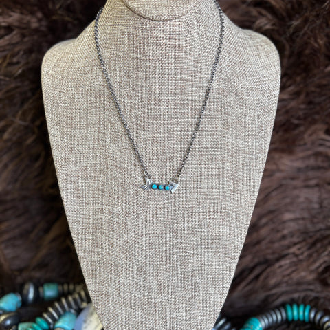 Sterling silver chain with small curved arrow with three small turquoise stones 