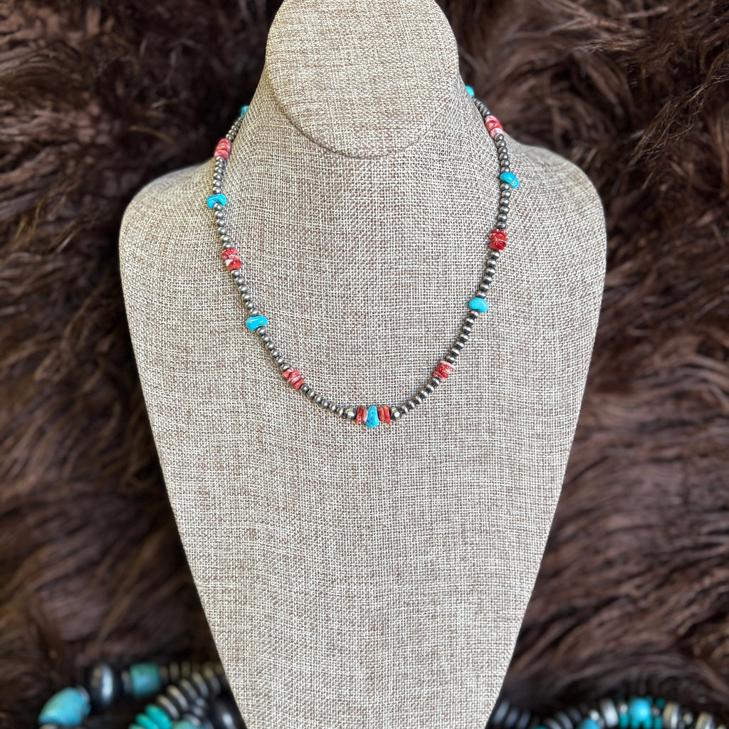 18 inch beaded necklace with small Navajo pearls, turquoise beads, and red/orange spiny stones 
