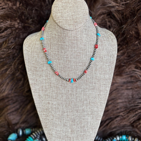 18 inch beaded necklace with small Navajo pearls, turquoise beads, and red/orange spiny stones 