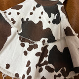 Close up view of the bell bottoms, two layers of the flare with frayed edges. 