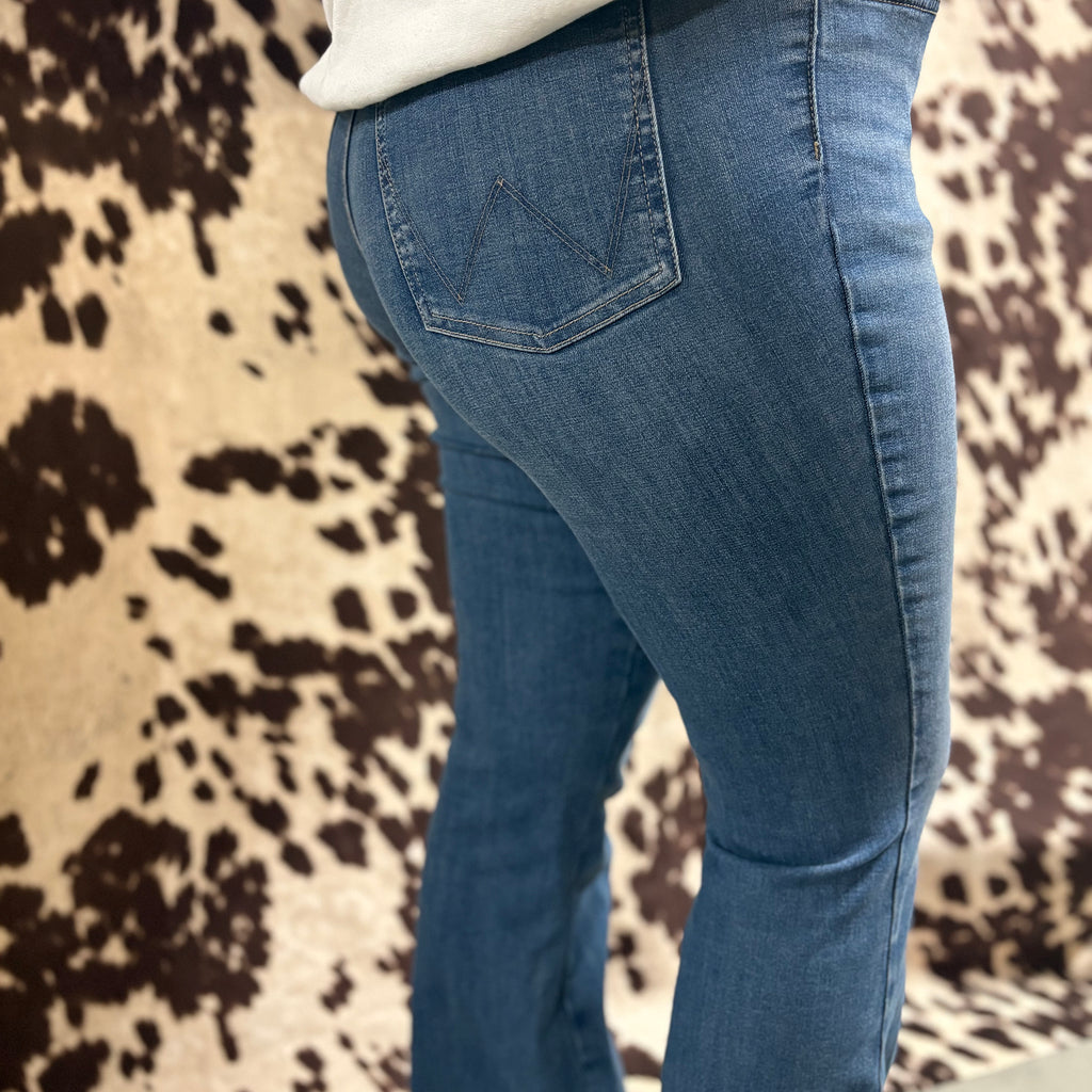 Side view of the jeans, light was coloring and simple stitching down the side of the leg.