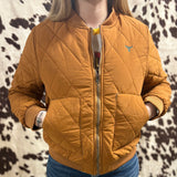 Front view of model wearing jacket zipped, camel color and slightly short.