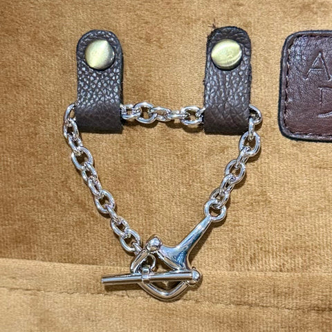 Silver chain bracelet with a horse bit on the end. 