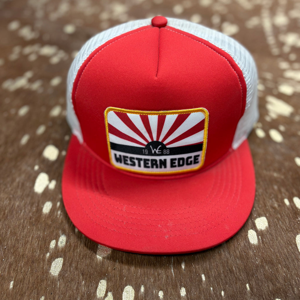 Red foam cap with white mesh back. cap has a patch on the front with gold stitched outline and red and white sunrise and black "Western Edge"