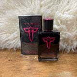 Bottle  and box of perfume, bottle is black with pink sparkles. Cap has a shiny pink top and bottle has a shiny pink and black "T" with "Femme Roma" under the logo.