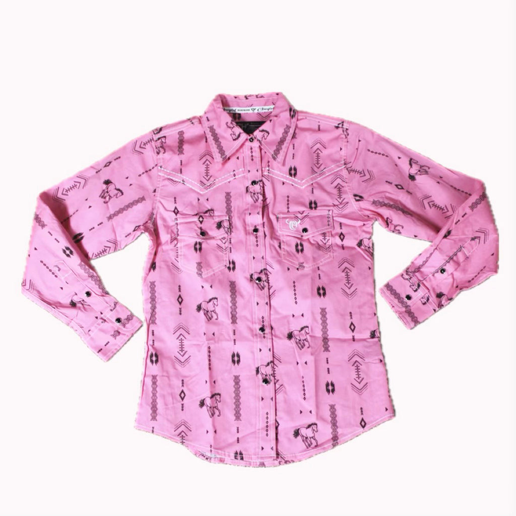 Flat lay of hot pink long sleeve shirt with black Aztec prints and horses for design. 