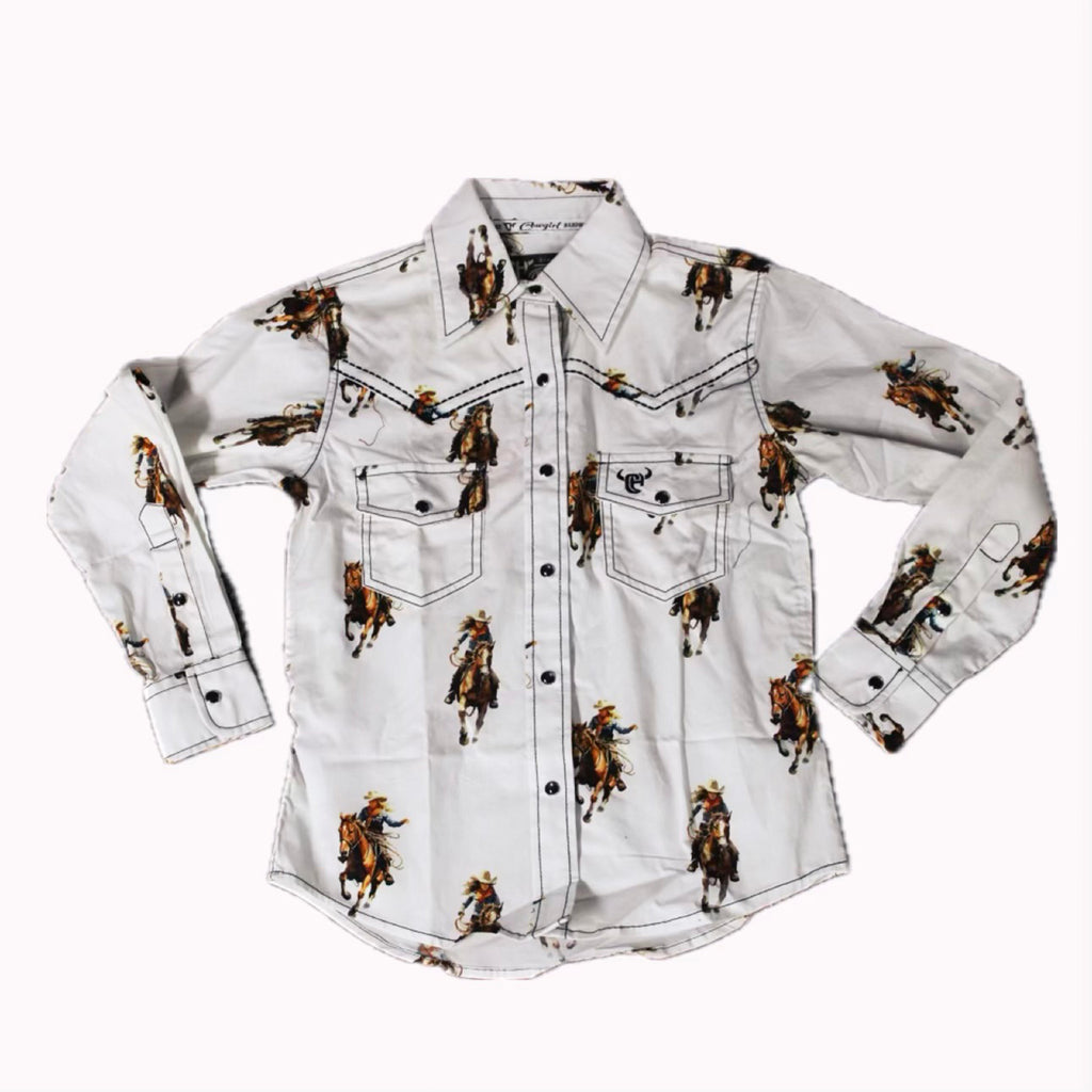 Flat lay of a white long sleeve shirt that has vintage cowgirl prints on it. 