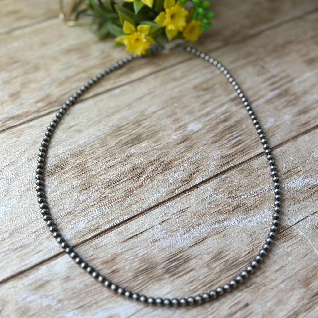 Flat lay Navajo Pearl necklace with 5mm pearls.