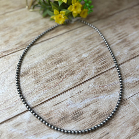 Flat lay Navajo Pearl necklace with 5mm pearls.