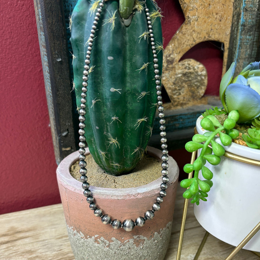 String of Navajo style pearls that are graduated.