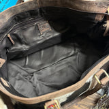 Open view of the inside of the bag, inside has a zipper pocket on the wall. 