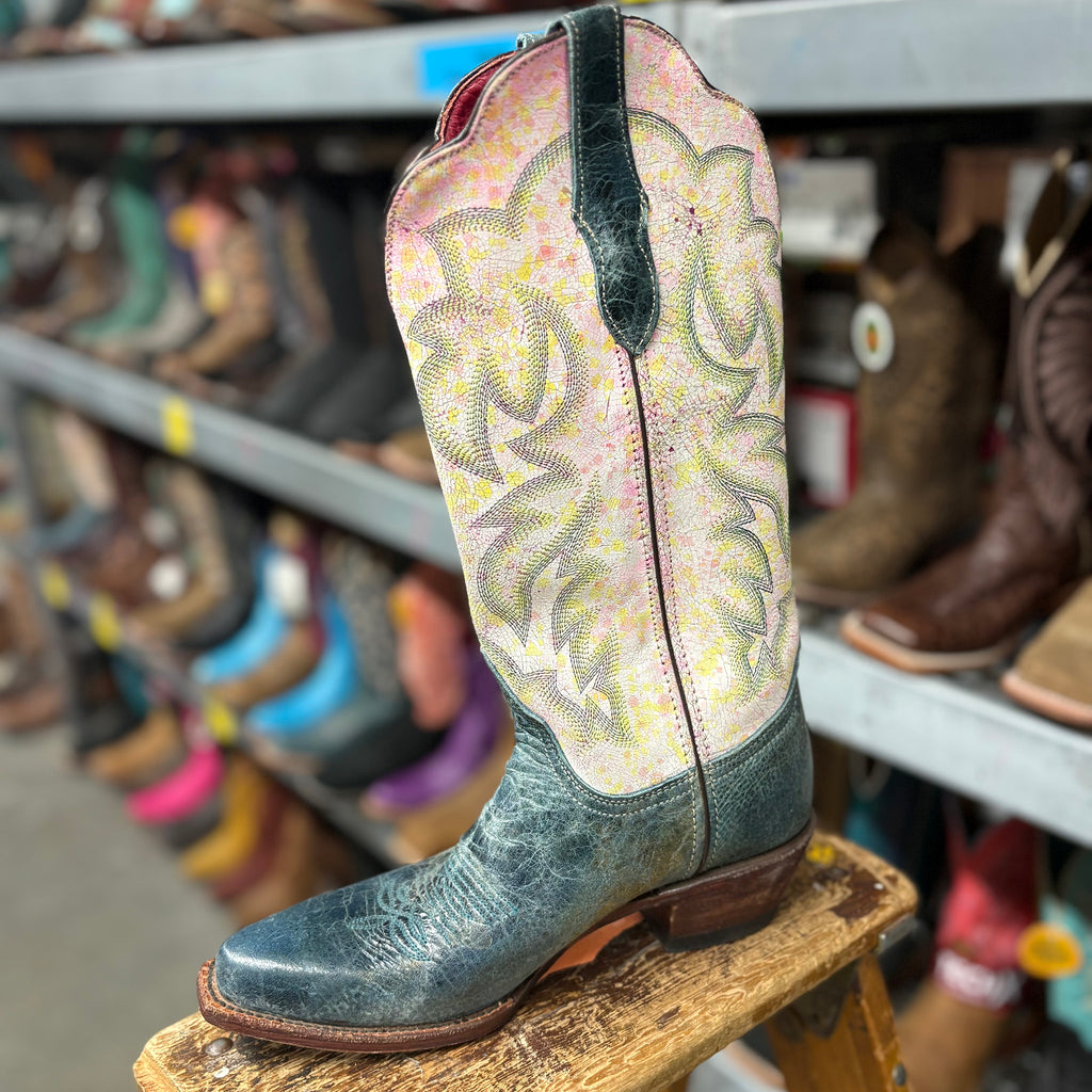 Pastel pink, yellow, and white boots with dark blue foot. 