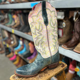 Pastel pink, yellow, and white boots with dark blue foot. 