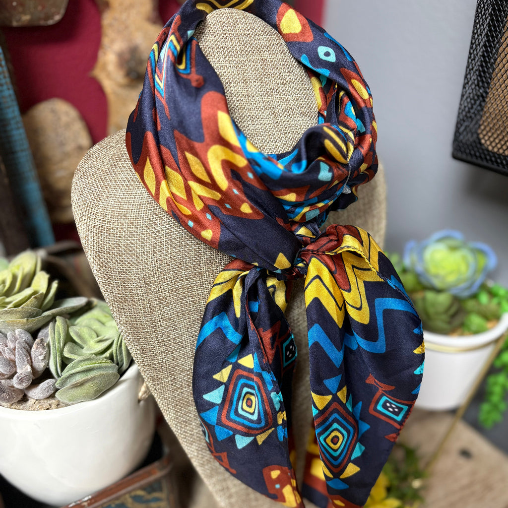 Blue, yellow, and red Aztec wild rag.