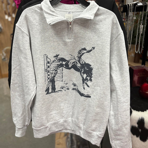 Grey quarter zip long sleeve sweater with navy blue bucking bronc chute motif on the front. 