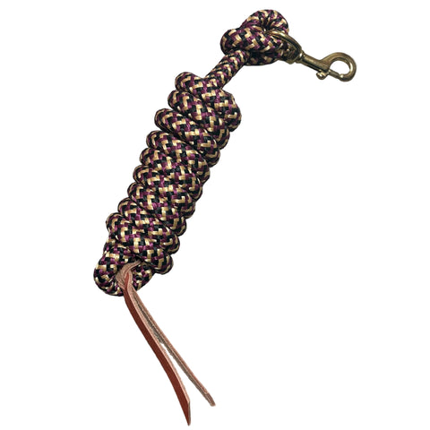 Flat lay of coiled up tan, burgundy, and black poly lead rope. 