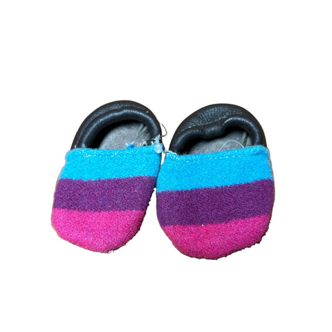 Front and top side view of multi colored baby moccasins. 