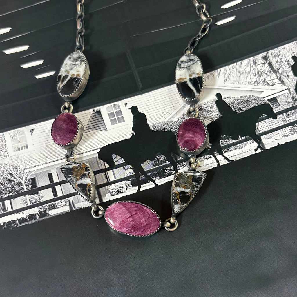Close up view of the "Raven" White Buffalo & Purple Spiny Oyster Necklace 