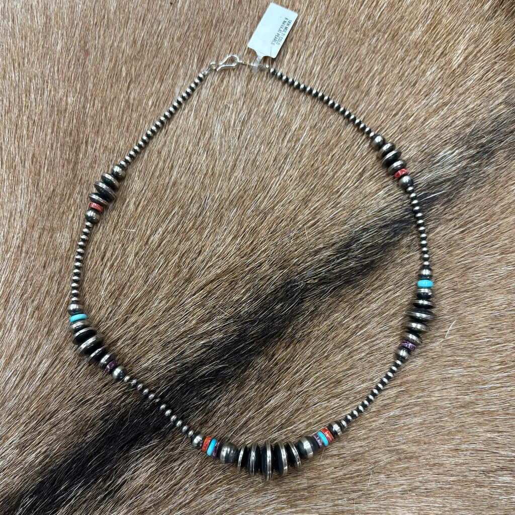 Full view of "Valorie" Necklace laying on cowhide 