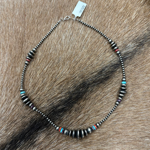 Full view of "Valorie" Necklace laying on cowhide 